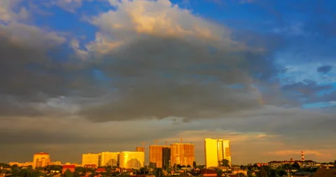 Flying clouds over cityscape at sunset Stock Footage 138442472