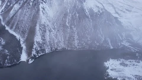 Flying in the clouds over the Kolsai mountain lake Vídeos de archivo 225845700