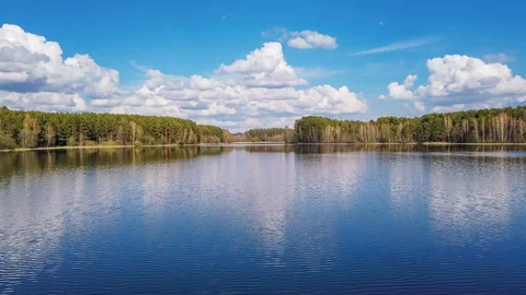 The flying clouds over the lake in Belarus Stock Footage 129842762