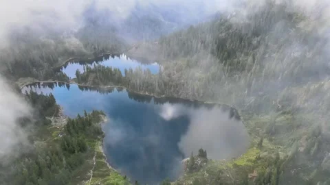 Flying in the clouds over lakes 스톡 동영상 331960686