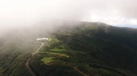 Flying in clouds over mountains and forest of Madeira, Portugal aerial view Stock Footage 68447038
