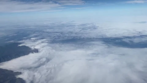 Flying in the clouds over mountains Stock Footage 270155449