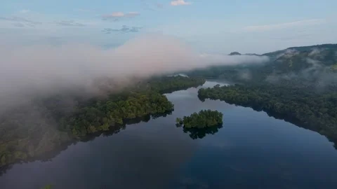Flying in clouds over savitri river backwaters, Poladpur, Maharashtra, India Stock Footage 320555279