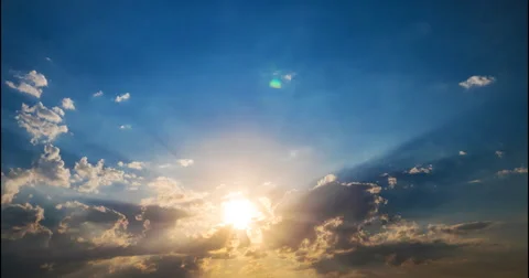 Flying clouds at sunset and  rays of  sun Stock Footage 68955214