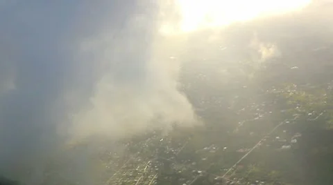 Flying into the clouds in sunset Stock Footage 8945219