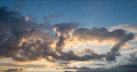 Flying clouds at sunset Stock Footage 68953424