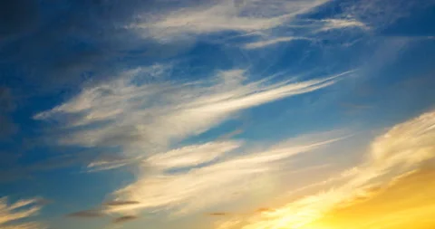 Flying clouds at sunset Stock Footage 138444758