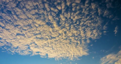 Flying clouds at sunset Stock Footage 143953446