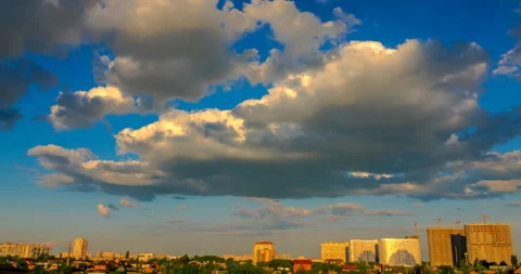 Flying clouds at sunset over the town landscape Stock Footage 138443742