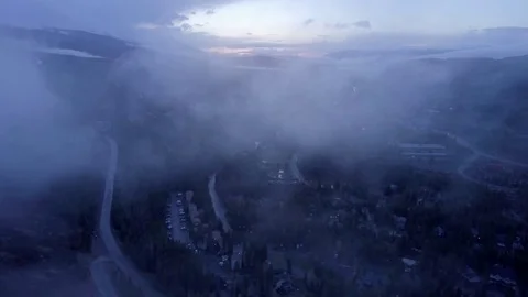 Flying Into Clouds at Sunset in Rocky Mountains Video stock 82919947