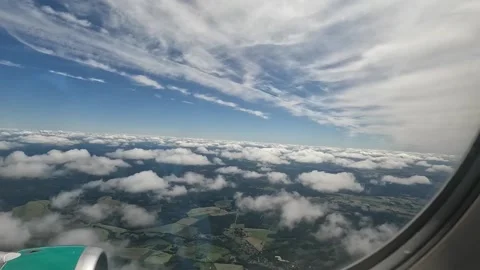 Flying by clouds - view from passenger airplane window Video stock 220875182