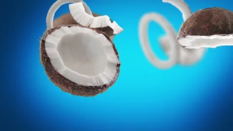 Flying Coconut and Coconuts slices in Blue Background Video stock 229493636