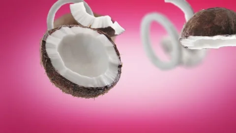 Flying Coconut and Coconuts slices in Pink Background Stock Footage 229562543