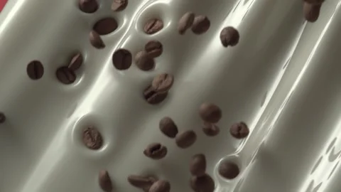 Flying coffee beans mix into flowing milk in slow motion Stock Footage 161525863