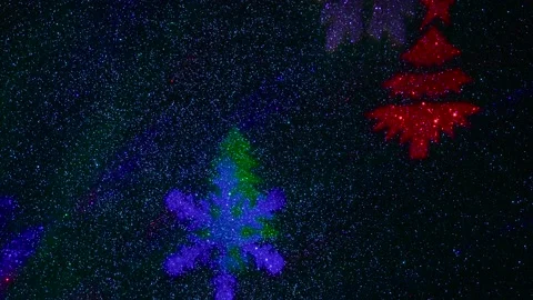 Flying colored silhouettes of Christmas trees and snowflakes. Stock-Footage 202039676