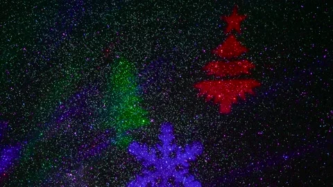 Flying colored silhouettes of Christmas trees and snowflakes. Stock-Footage 202039844