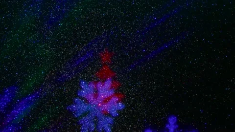 Flying colored silhouettes of Christmas trees and snowflakes. 動画素材 202040053