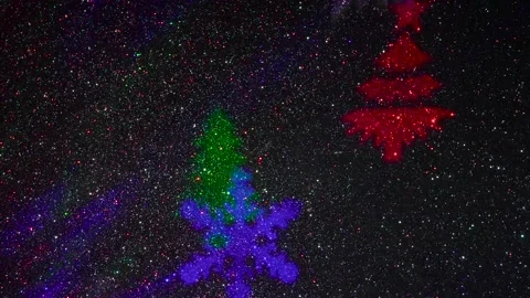 Flying colored silhouettes of Christmas trees and snowflakes. Stock-Footage 202040268