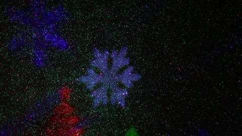 Flying colored silhouettes of Christmas trees and snowflakes. Stock-Footage 202040342