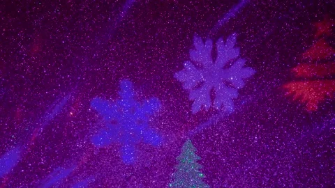 Flying colored silhouettes of Christmas trees and snowflakes. Stock-Footage 202040623