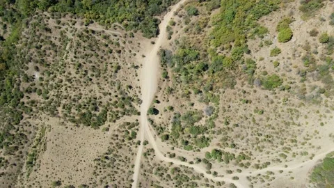 Flying the copter down onto the savannah road Video stock 137888784