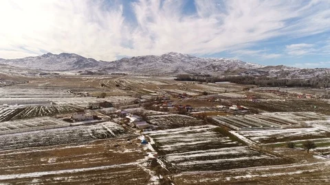 Flying copter over old turkish city near the Taurus Mountains covered with snow Stock Footage 87129287