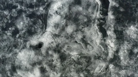 Flying a copter over a river covered with ice. Unique ice pattern on the lake Video stock 155184274