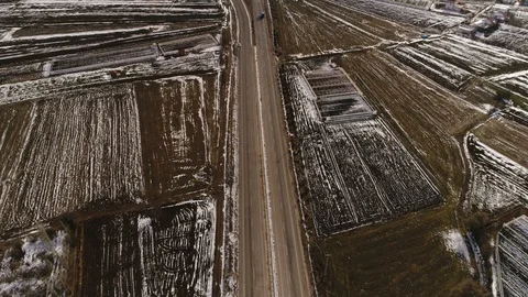 Flying copter over road full of driving cars surrounded by valleys and Taurus Stock Footage 87126278