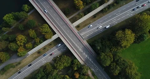 Flying copter over transport interchange surrounded by trees in Heilbronn in Stock Footage 87552478