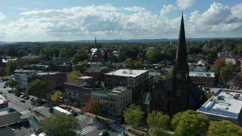 Flying counter clockwise around First Church on Main St. in Northampton MA Stock Footage 140645001