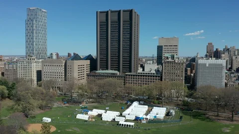 Flying counter clockwise around tent Hospital in New York Central Park Covid Video stock 127881516