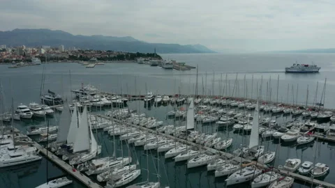 Flying counter clockwise over marina in bay of Split Croatia Stock Footage 142229296
