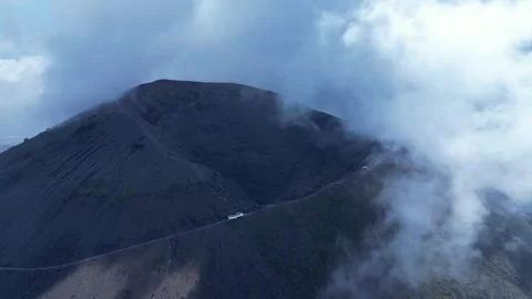 Flying to crater of Mount Vesuvius, covered in clouds, volcanic landscape Italy Stock Footage 328521626