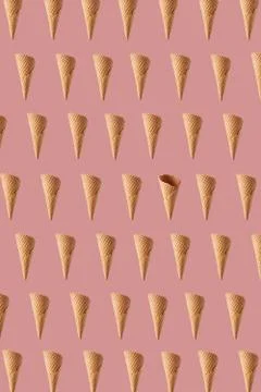 Flying crunchy waffle cones pattern for making sweet ice cream. Stock-Fotos
