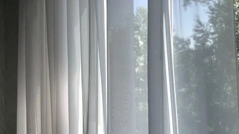 Flying curtains sheer curtains by the window. Stock Footage 142355601