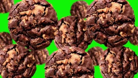 Flying Dark chocolate chip cookie of different diameters on the green screen Stock Footage 166412328