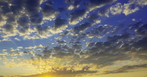 Flying dark clouds at sunset Stock Footage 154738994