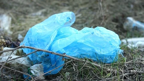 Flying debris in nature, carelessly throwing plastic bags. Stock Footage 127375503