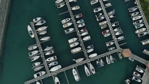 Flying directly over a marina filled with boats Stock Footage 158974705