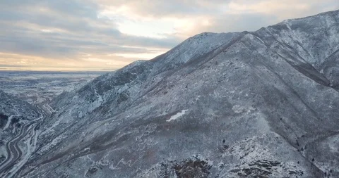 Flying DJI Mavic Pro through Ogden, Utah winter canyons along side traffic. Stock Footage 106433963