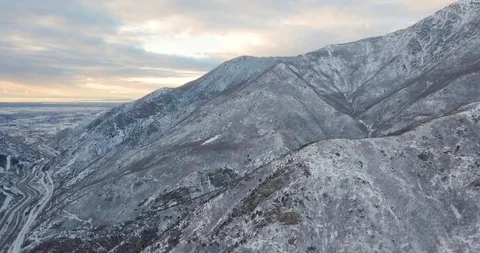 Flying DJI Mavic Pro through Ogden, Utah winter canyons along side traffic. Stock Footage 106434011