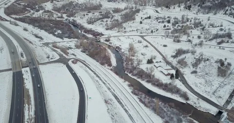 Flying DJI Mavic Pro through Ogden, Utah winter canyons along side traffic. Stock Footage 106434253