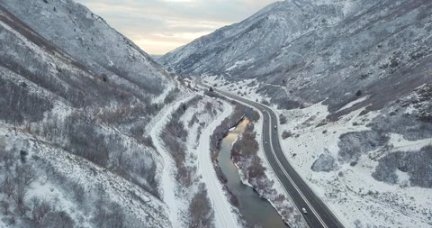 Flying DJI Mavic Pro through Ogden, Utah winter canyons along side traffic. Stock Footage 106434456