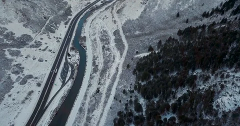 Flying DJI Mavic Pro through Ogden, Utah winter canyons along side traffic. Stock Footage 106434624