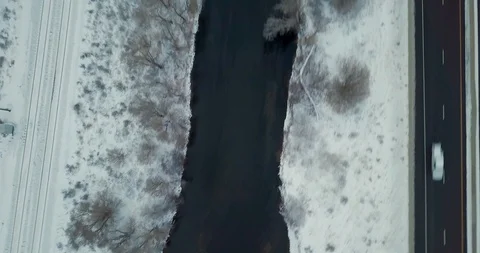 Flying DJI Mavic Pro through Ogden, Utah winter canyons along side traffic. Stock Footage 106434823