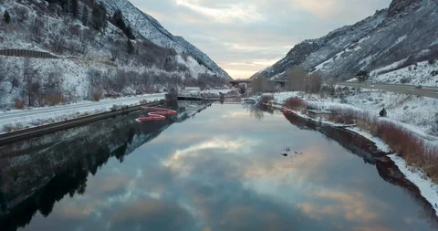 Flying DJI Mavic Pro through Ogden, Utah winter canyons along side traffic. Stock Footage 106435827