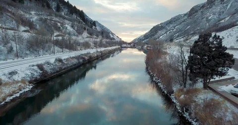 Flying DJI Mavic Pro through Ogden, Utah winter canyons along side traffic. Stock Footage 106435871