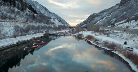 Flying DJI Mavic Pro through Ogden, Utah winter canyons along side traffic. Stock Footage 106464005