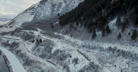 Flying DJI Mavic Pro through Ogden, Utah winter canyons along side traffic. Stock Footage 106464151