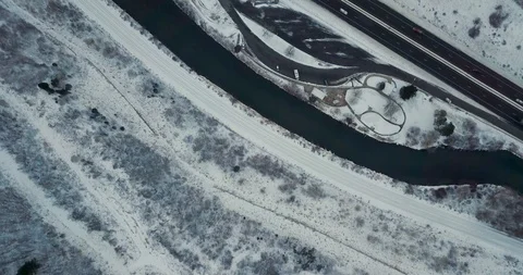 Flying DJI Mavic Pro through Ogden, Utah winter canyons along side traffic. Stock Footage 106464318